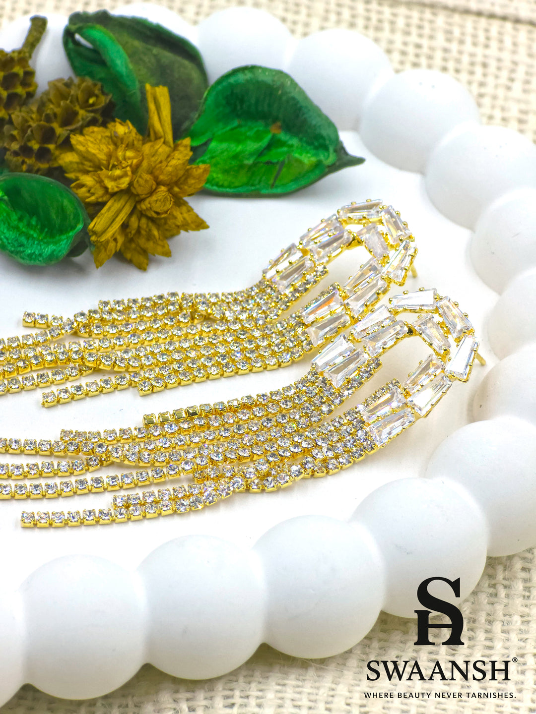Long gold tassel earrings with baguette-cut crystal tops and fine zirconia strands – Swaansh