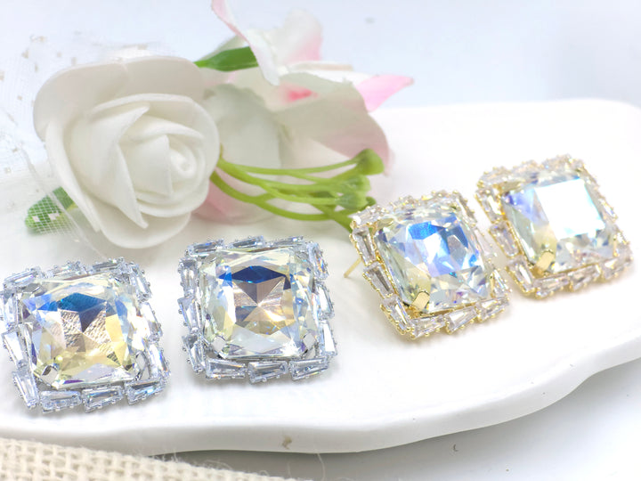 Large radiant-cut square prism stud earrings with baguette zirconia halo in gold – Swaansh