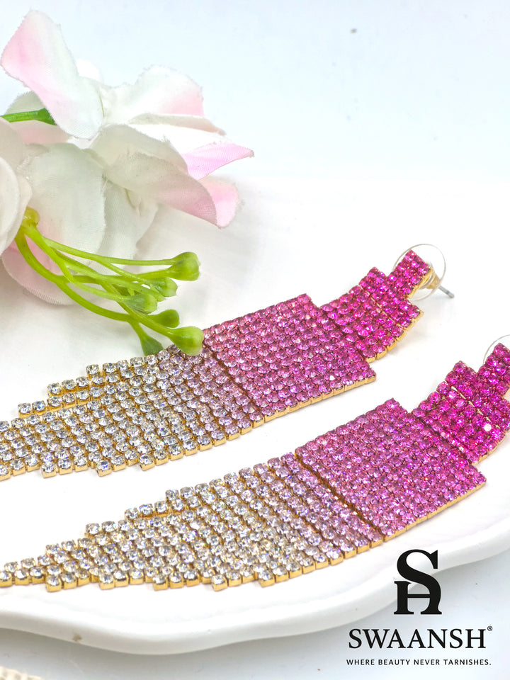 Long ombre tassel earrings transitioning from deep pink to champagne crystals on gold base – Swaansh