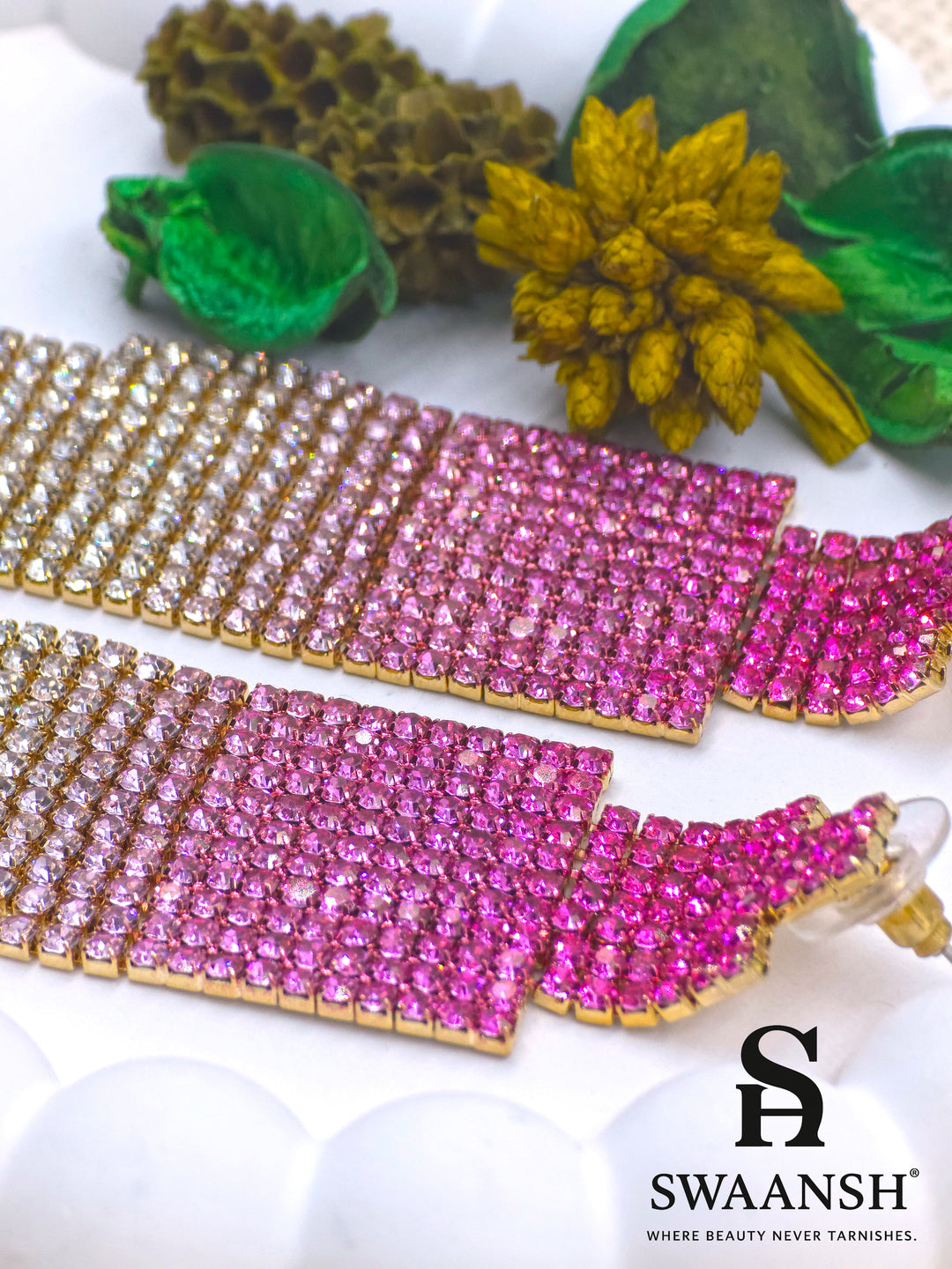 Long ombre tassel earrings transitioning from deep pink to champagne crystals on gold base – Swaansh