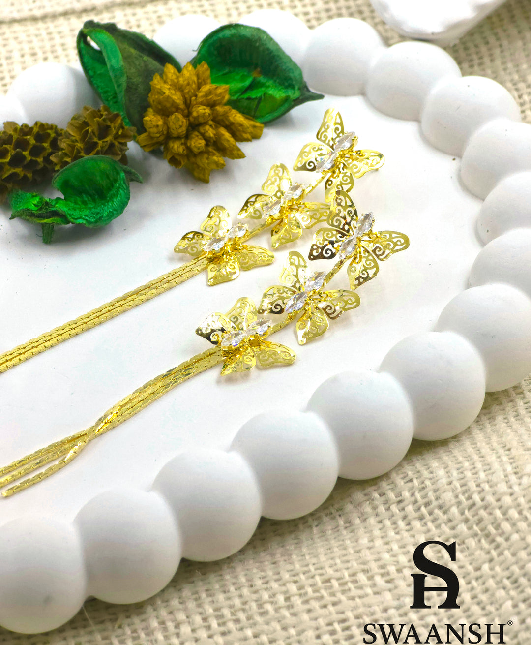 Gold butterfly filigree earrings with zirconia accents and long tassel chains – Swaansh