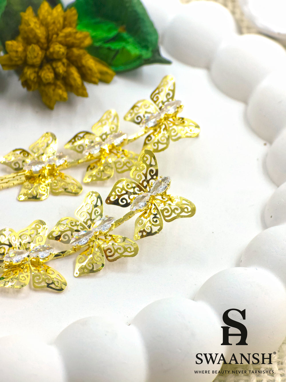 Gold butterfly filigree earrings with zirconia accents and long tassel chains – Swaansh