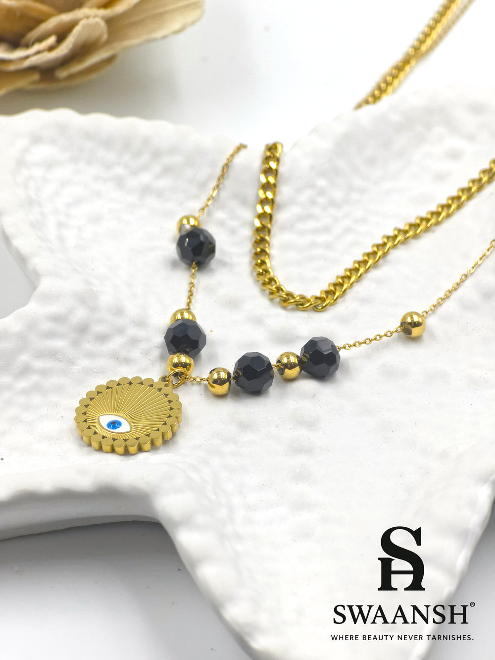 Elysian Shield by Swaansh featuring gold evil eye charm with black and gold bead dual chain