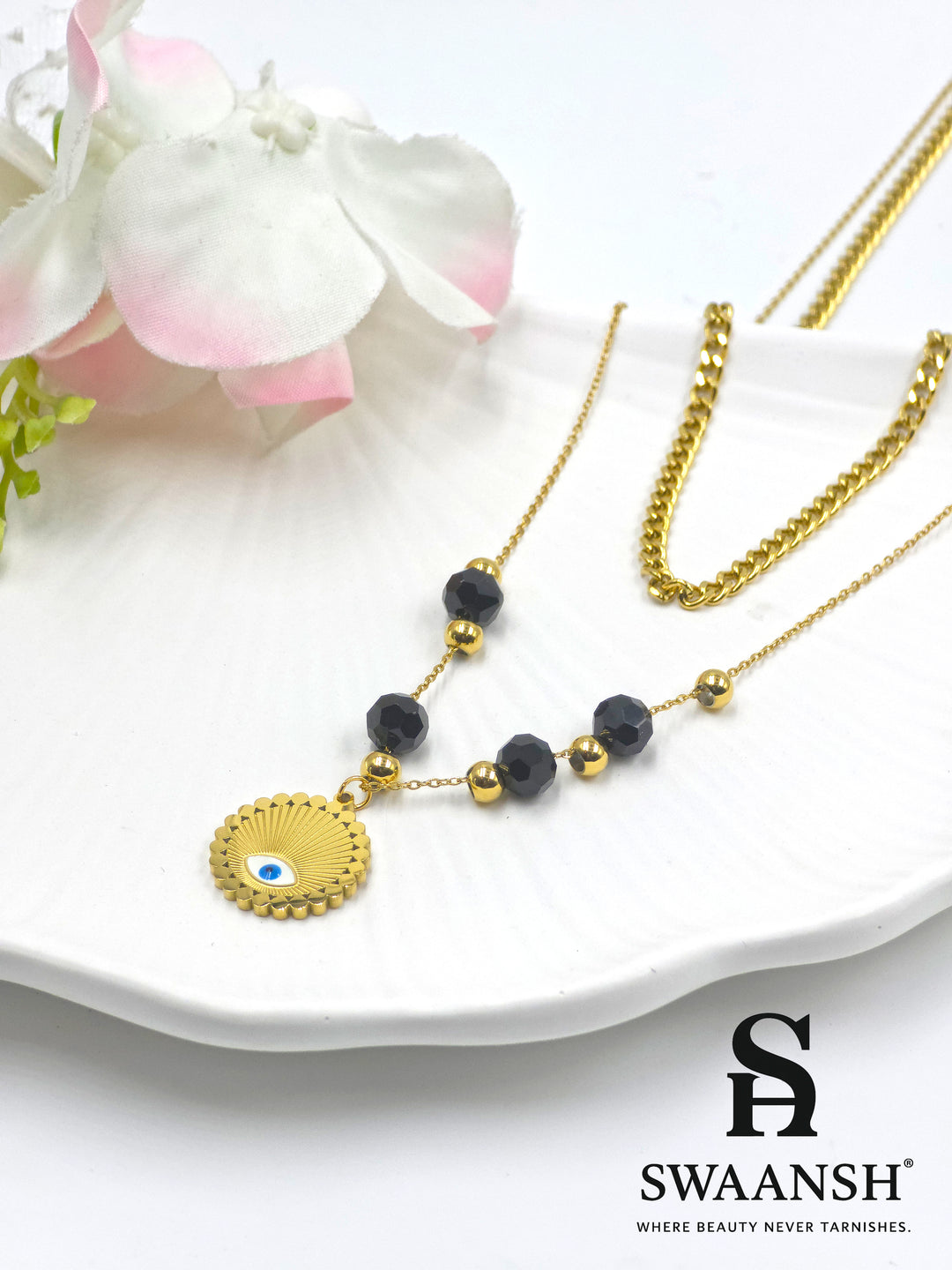 Elysian Shield by Swaansh featuring gold evil eye charm with black and gold bead dual chain