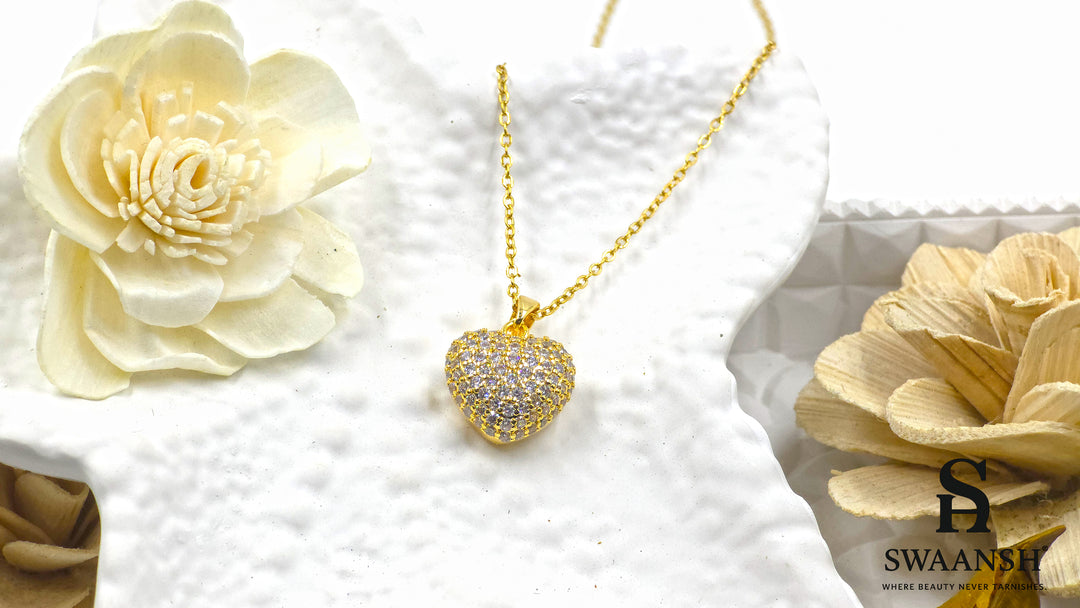 Crowned Heart Pendant by Swaansh featuring pavé crystal-encrusted heart charm on gold-plated chain