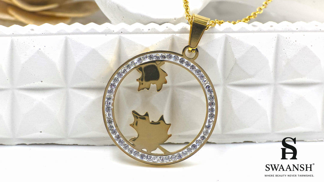 Autumn Radiance Pendant by Swaansh featuring gold maple leaves inside a crystal-lined circular frame
