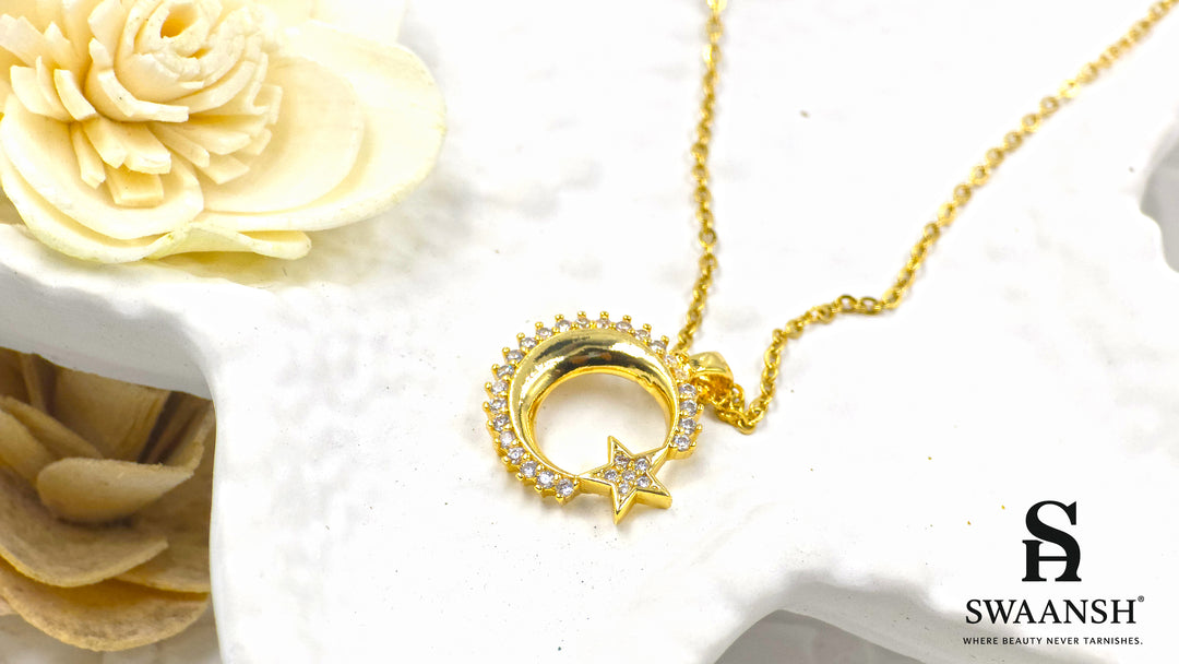 Celestial Glow Pendant by Swaansh featuring gold crescent moon and star with crystal accents on a fine chain
