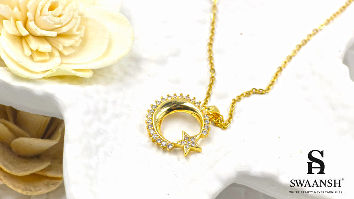 Celestial Glow Pendant by Swaansh featuring gold crescent moon and star with crystal accents on a fine chain