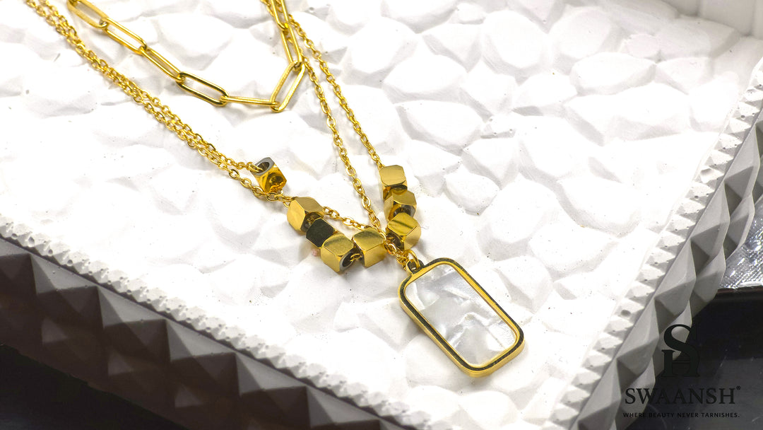 Modern Muse Pendant by Swaansh featuring dual-chain design with rectangular shell charm and gold cube beads