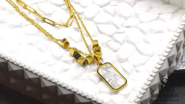 Modern Muse Pendant by Swaansh featuring dual-chain design with rectangular shell charm and gold cube beads
