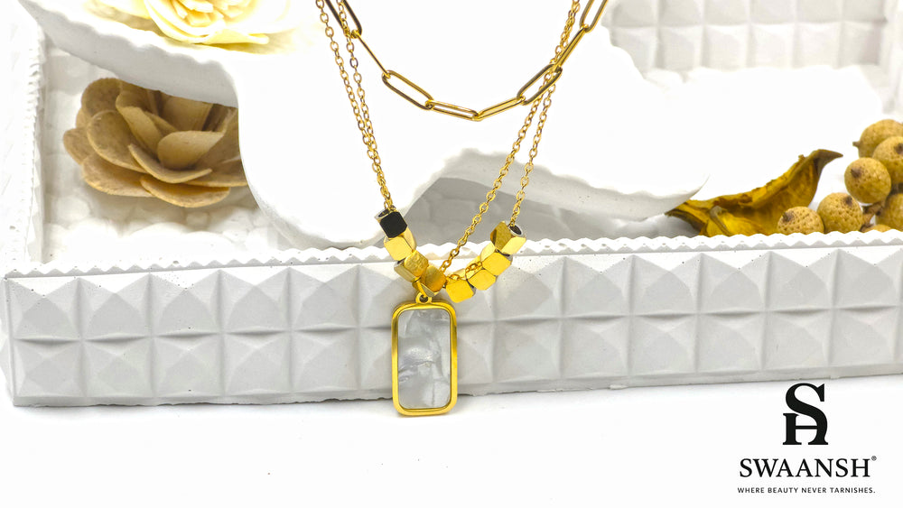 Modern Muse Pendant by Swaansh featuring dual-chain design with rectangular shell charm and gold cube beads
