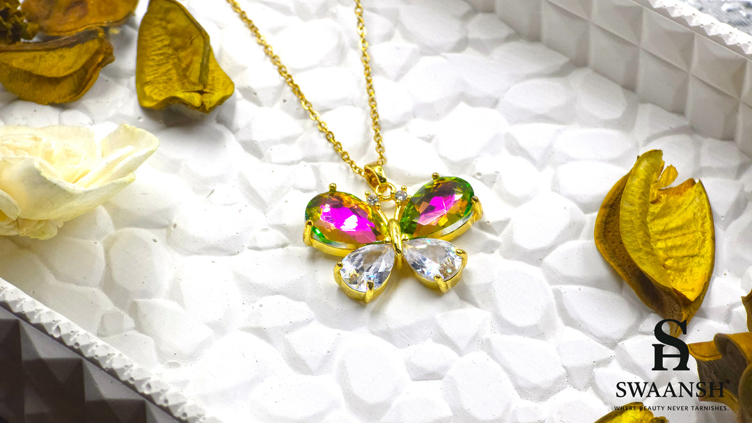 Prism Wings Pendant by Swaansh featuring multicolour iridescent butterfly with gold-plated setting and crystal wings