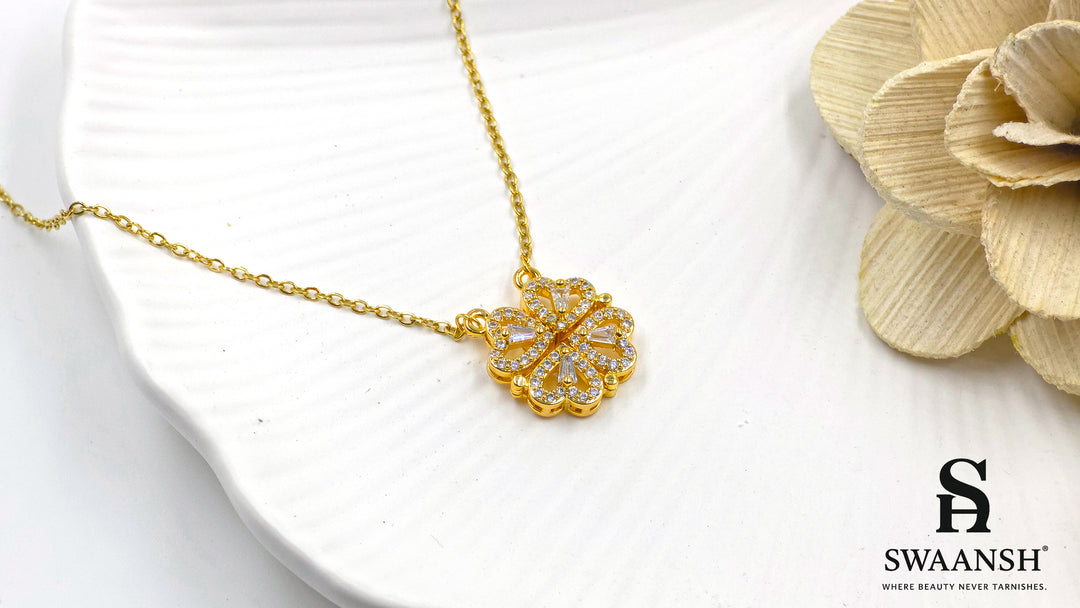 Hearts of Fortune Pendant by Swaansh featuring crystal-studded four-leaf clover and heart cascade designs in gold