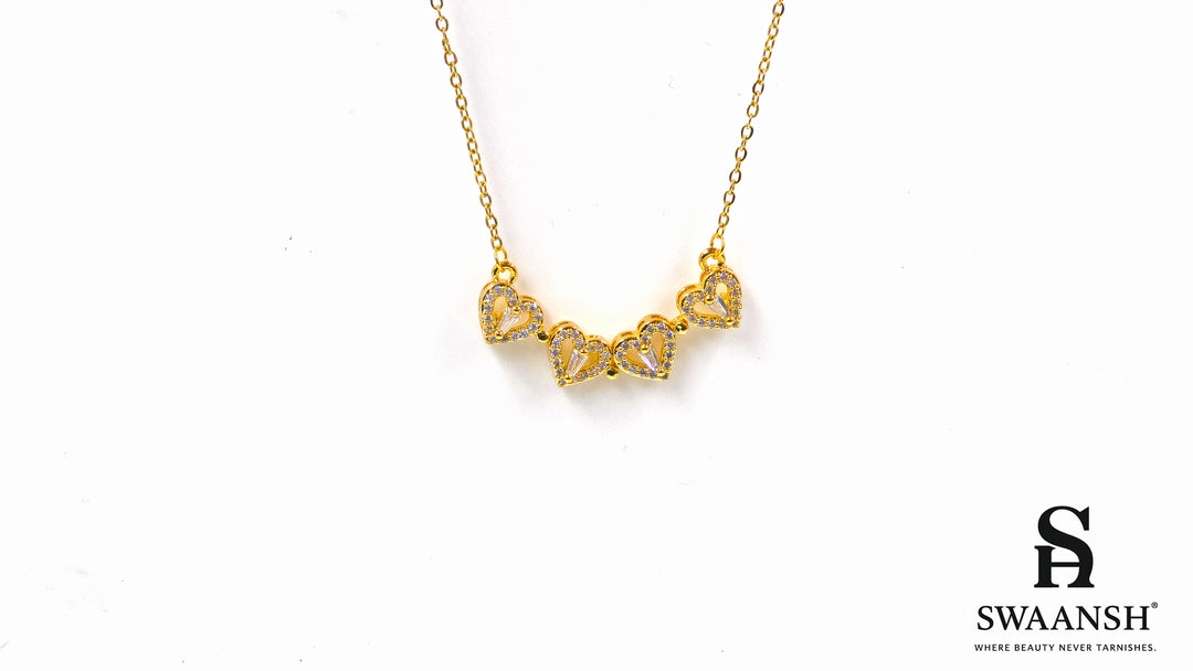 Hearts of Fortune Pendant by Swaansh featuring crystal-studded four-leaf clover and heart cascade designs in gold