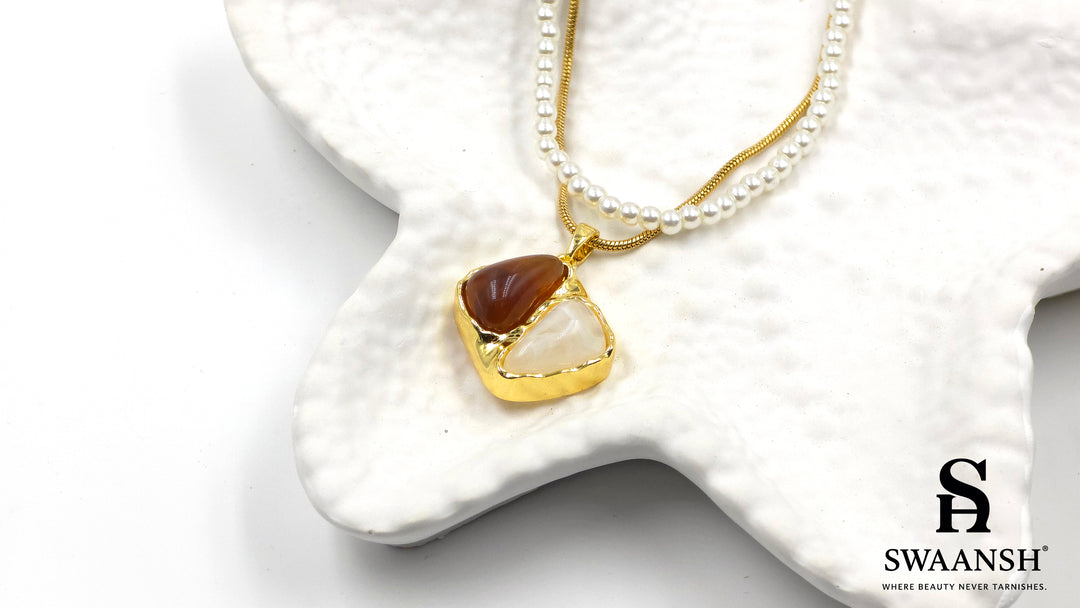Terra Soul Pendant by Swaansh featuring dual-stone gold charm with layered pearl and gold snake chain