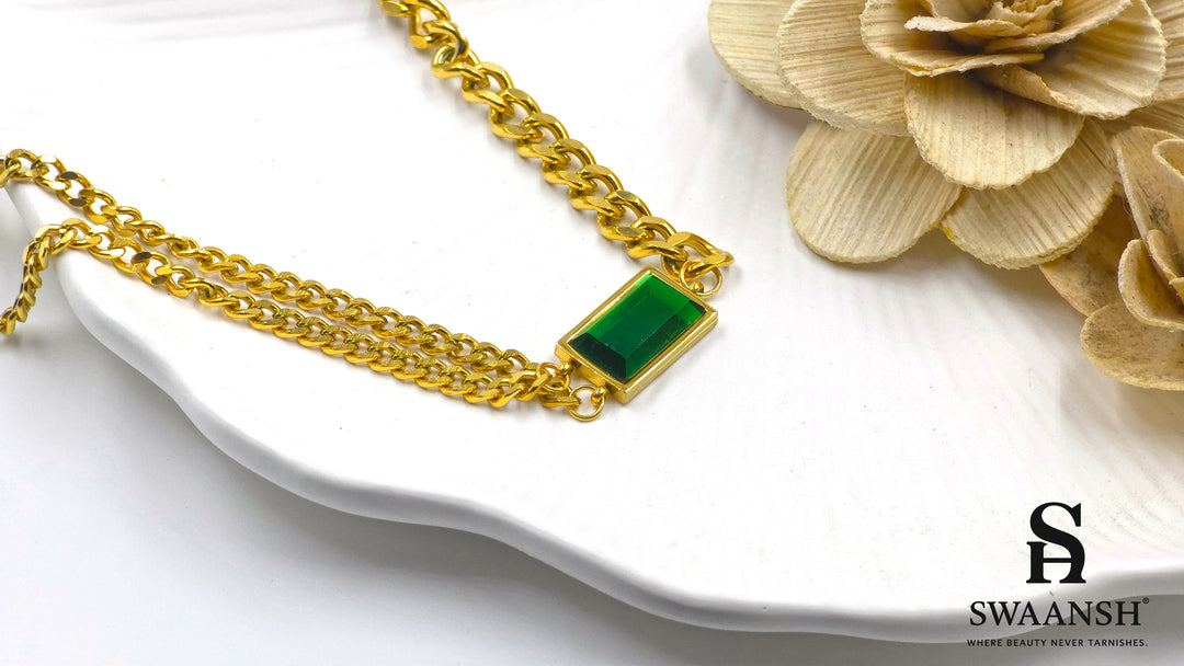 Emerald Edge Pendant by Swaansh featuring bold green rectangular crystal on a twin gold chain