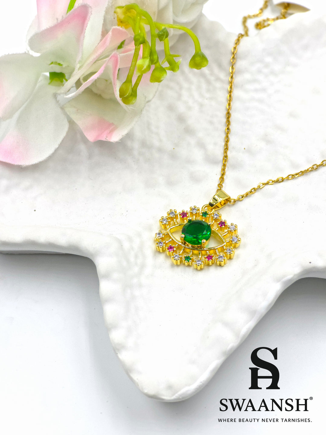 Emerald Guardian Pendant by Swaansh featuring green crystal evil eye with multicolour halo in gold finish