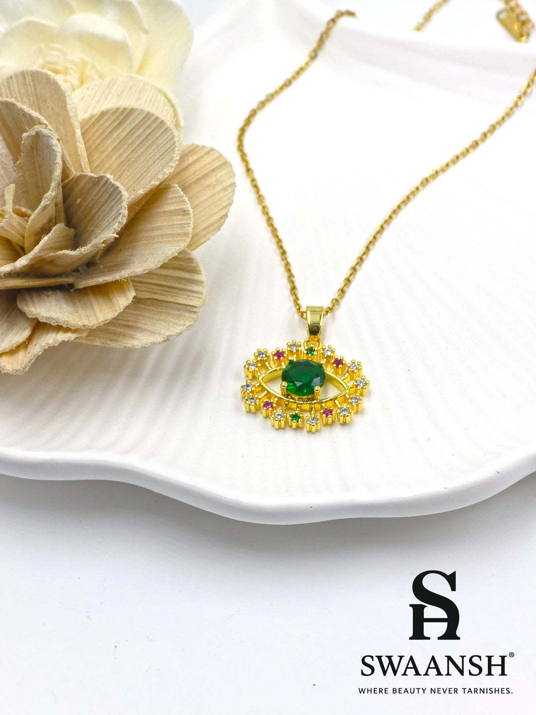 Emerald Guardian Pendant by Swaansh featuring green crystal evil eye with multicolour halo in gold finish