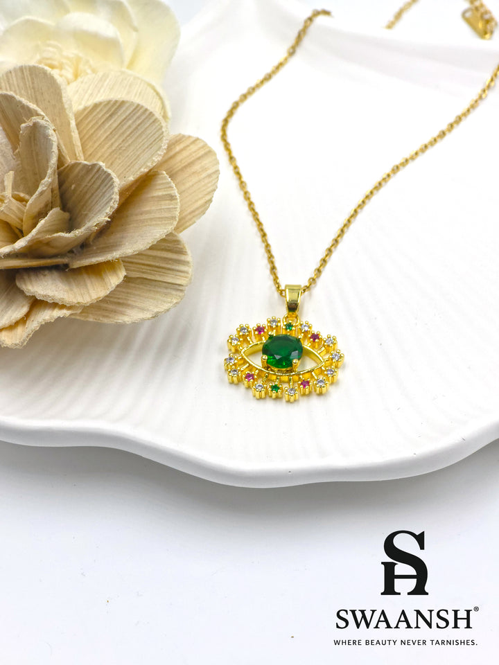 Emerald Guardian Pendant by Swaansh featuring green crystal evil eye with multicolour halo in gold finish