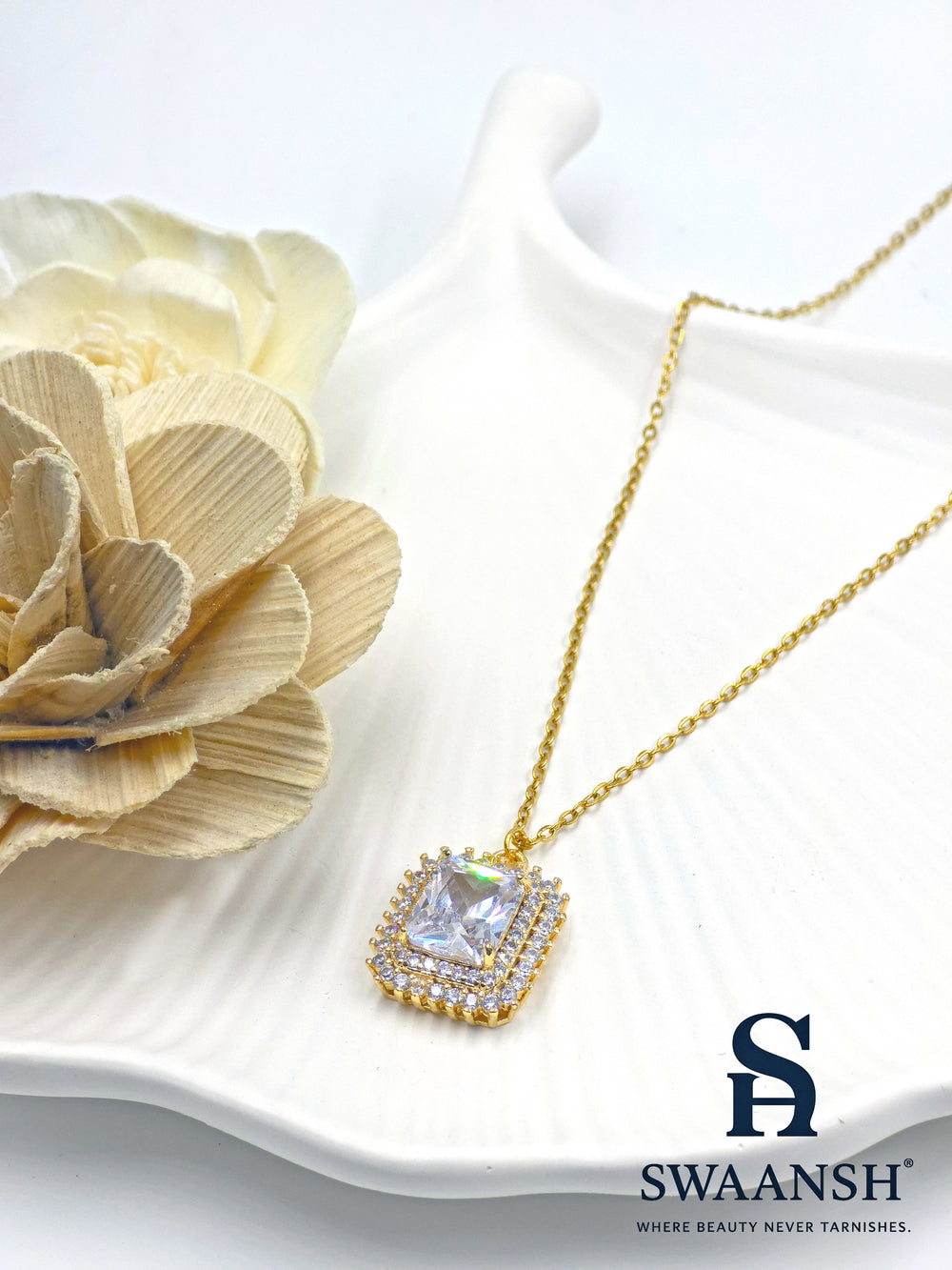 Crown Radiant Pendant by Swaansh featuring princess-cut center stone with double pavé crystal halo in square gold frame
