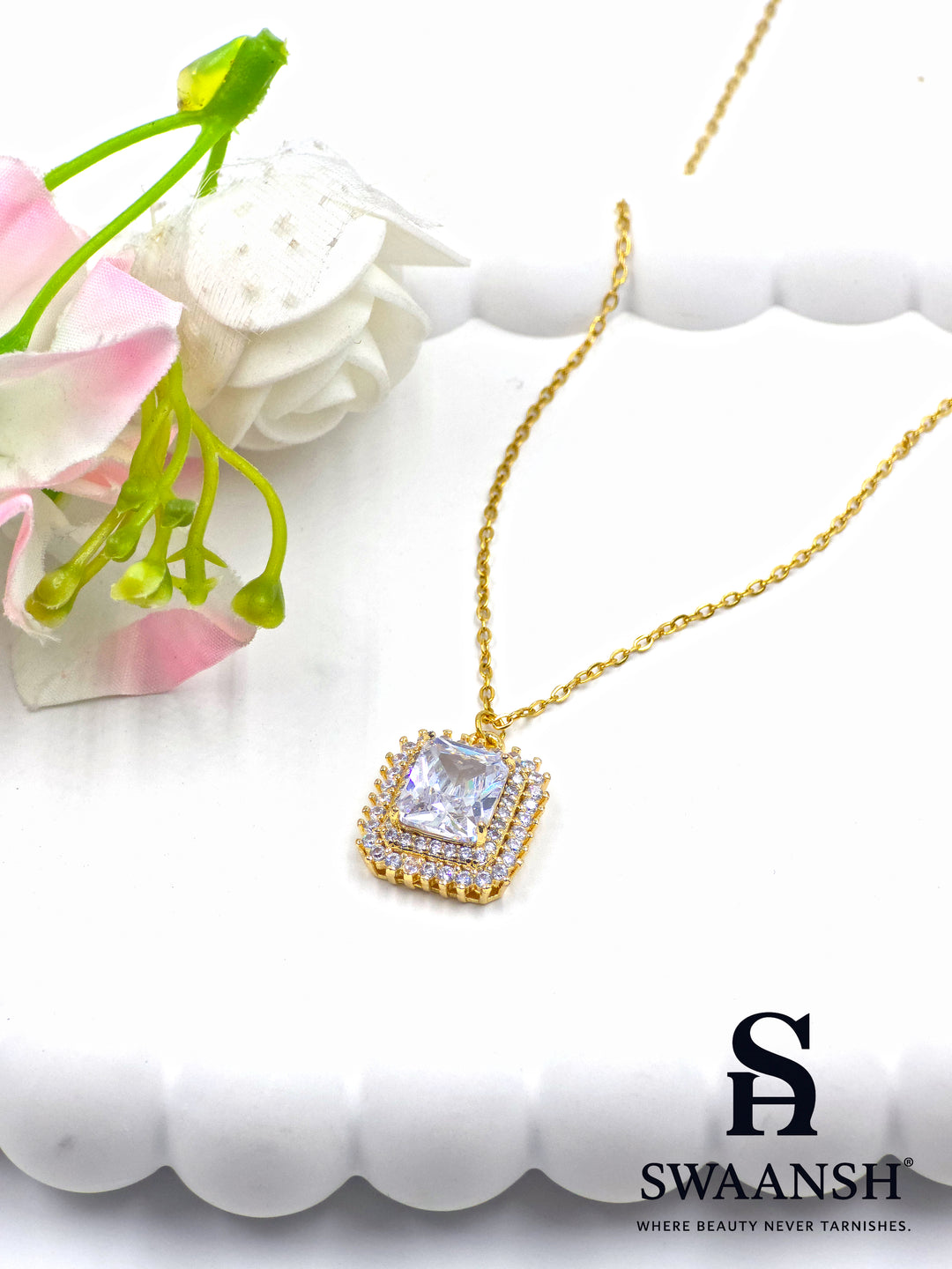 Crown Radiant Pendant by Swaansh featuring princess-cut center stone with double pavé crystal halo in square gold frame