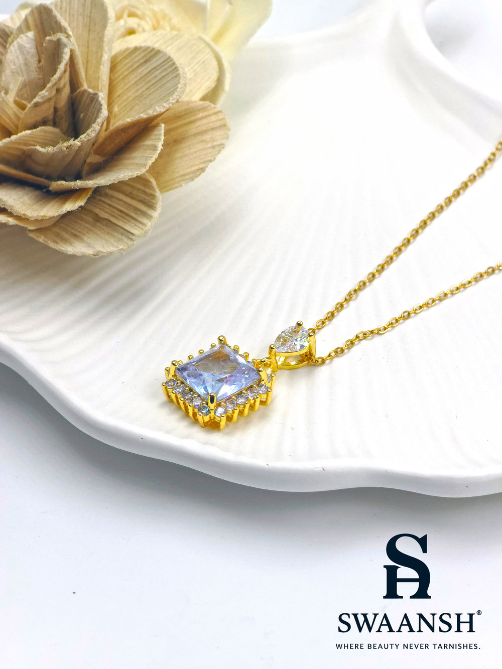 Diamond Drape Pendant by Swaansh featuring princess-cut crystal with pavé halo and teardrop top stone in gold finish