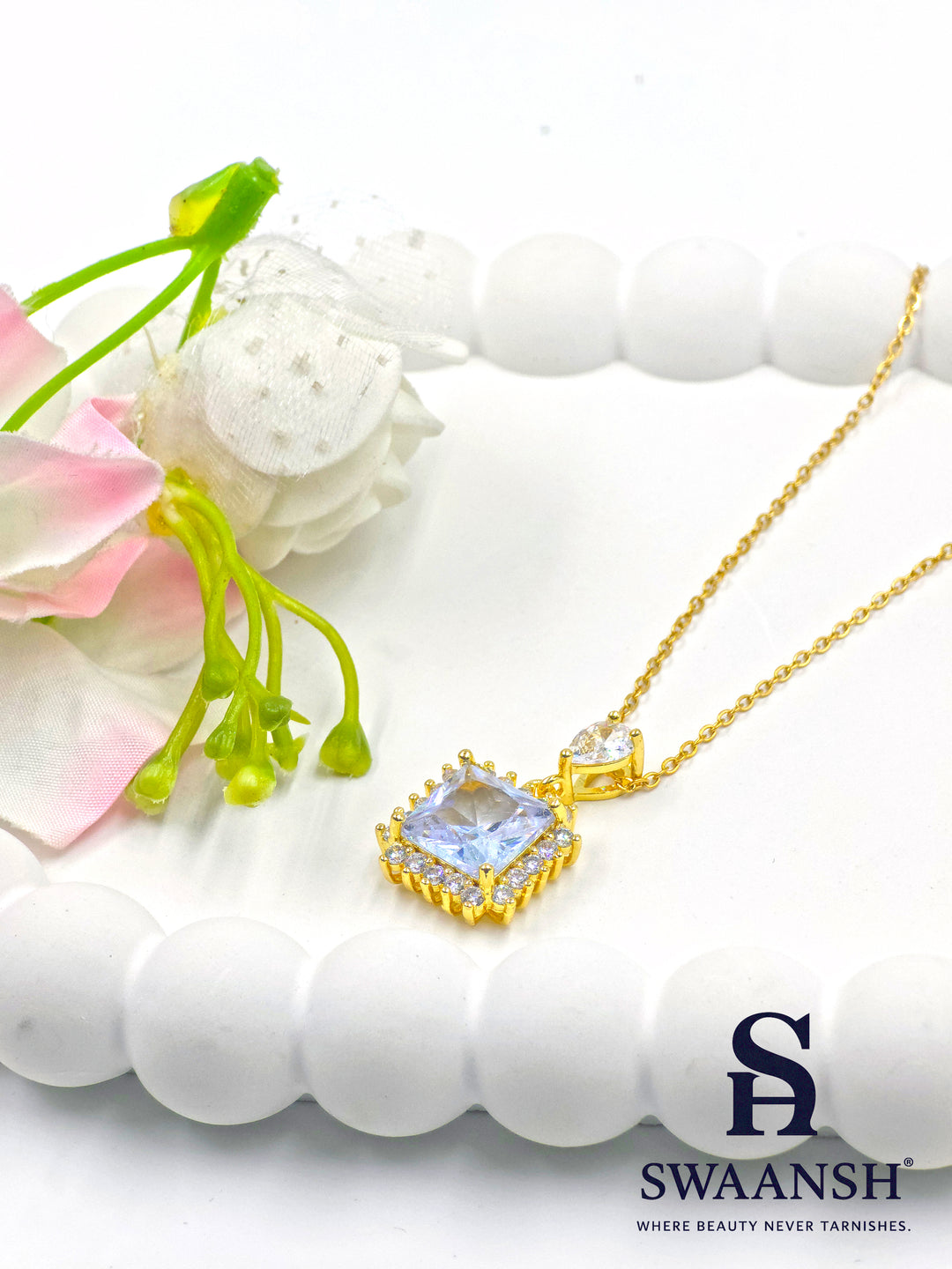 Diamond Drape Pendant by Swaansh featuring princess-cut crystal with pavé halo and teardrop top stone in gold finish

