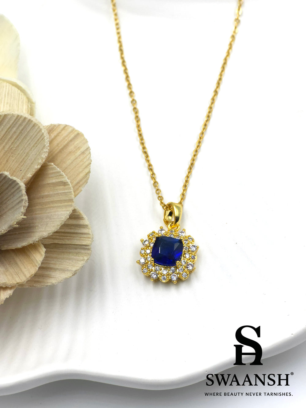 Midnight Royale Pendant by Swaansh featuring sapphire-blue cushion-cut crystal with pavé halo in gold finish