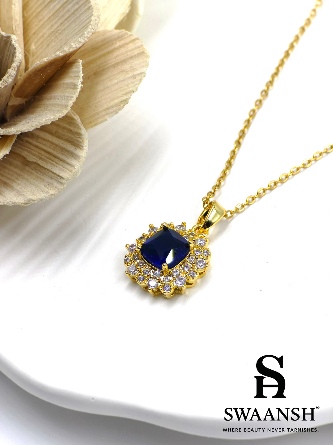 Midnight Royale Pendant by Swaansh featuring sapphire-blue cushion-cut crystal with pavé halo in gold finish