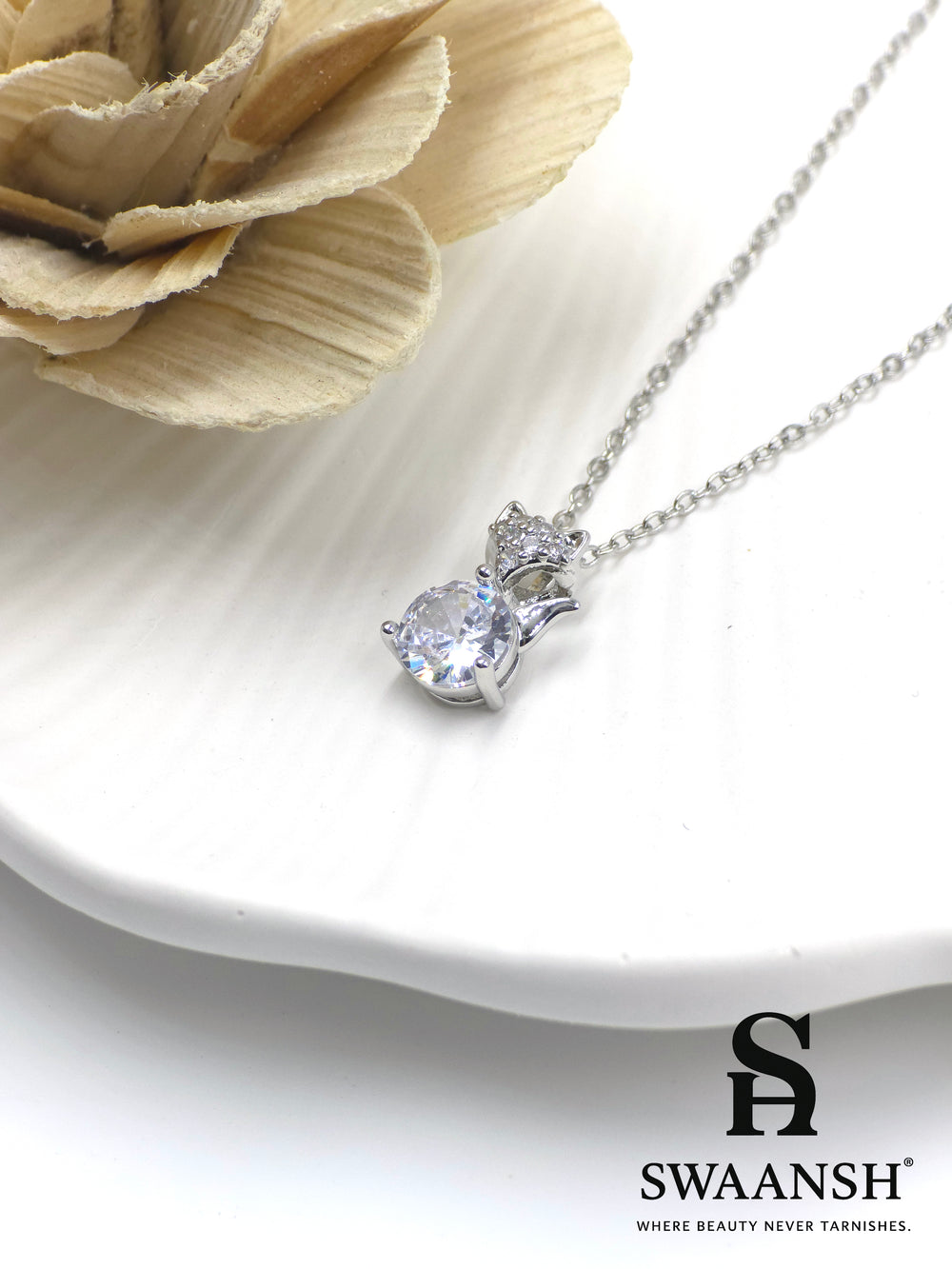 Frost Whiskers Pendant by Swaansh featuring a silver cat-shaped charm with round crystal center and pavé ears