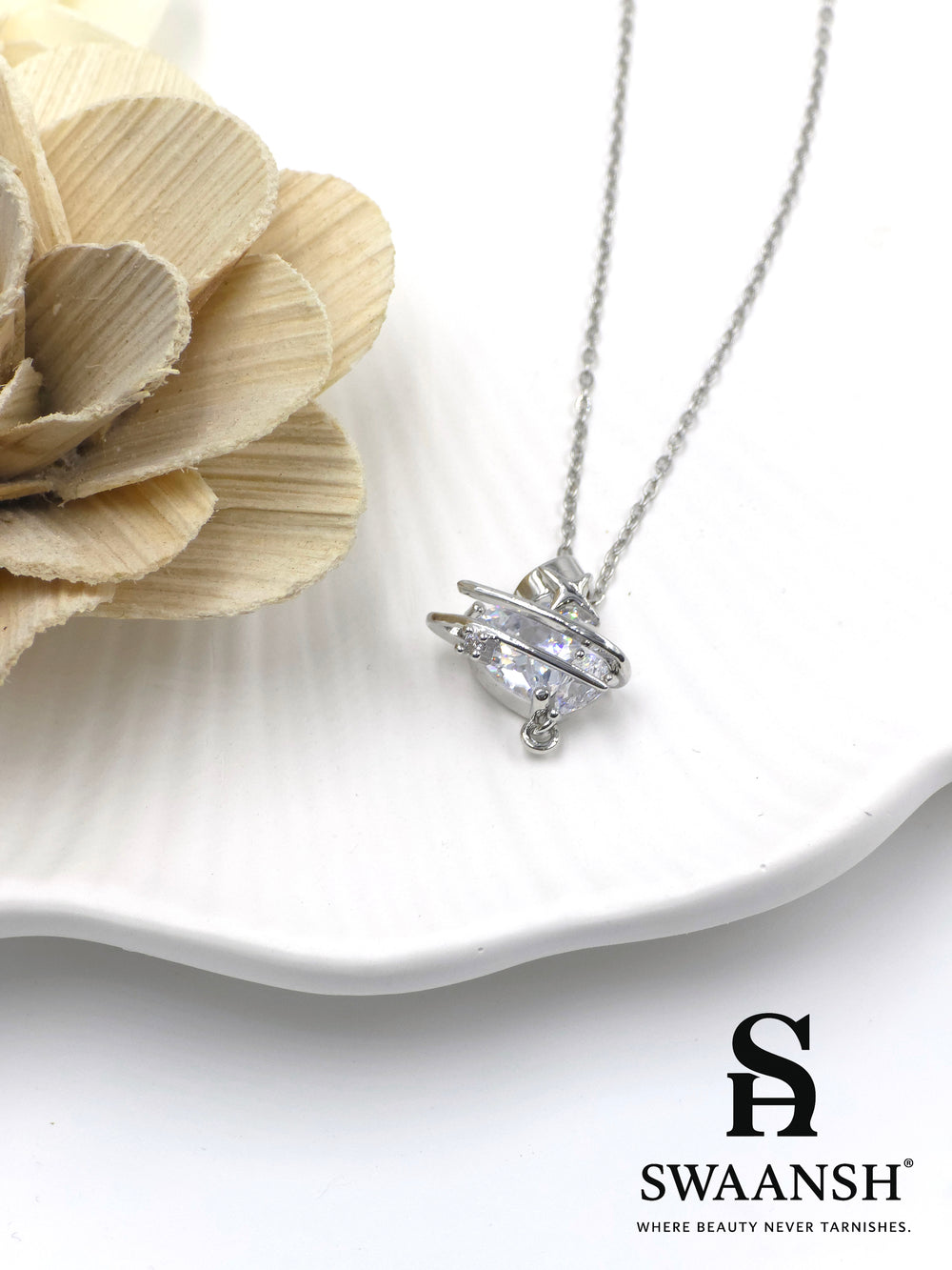 Galactic Spark Pendant by Swaansh featuring silver UFO-shaped design with central crystal accent