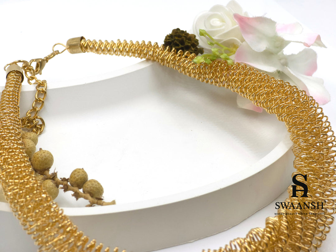 Helix Drape Choker by Swaansh featuring sculpted gold mesh coils in a wide choker silhouette