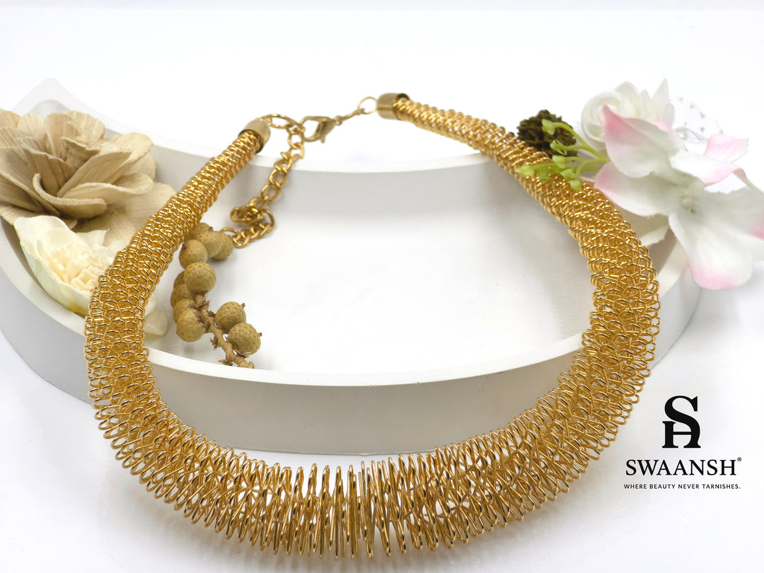 Helix Drape Choker by Swaansh featuring sculpted gold mesh coils in a wide choker silhouette