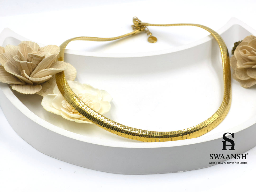 The Gilded Curve choker by Swaansh featuring sleek gold snake design in high-polish anti-tarnish finish