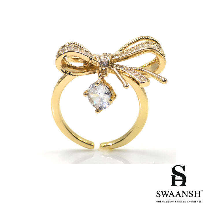 Adjustable gold ring with bow design and solitaire zircon drop – Sparkle Bow Ring by Swaansh