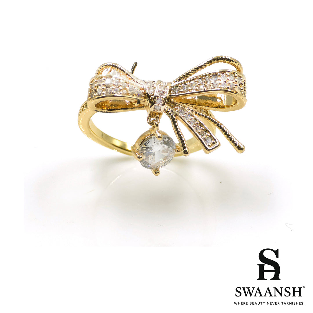 Adjustable gold ring with bow design and solitaire zircon drop – Sparkle Bow Ring by Swaansh