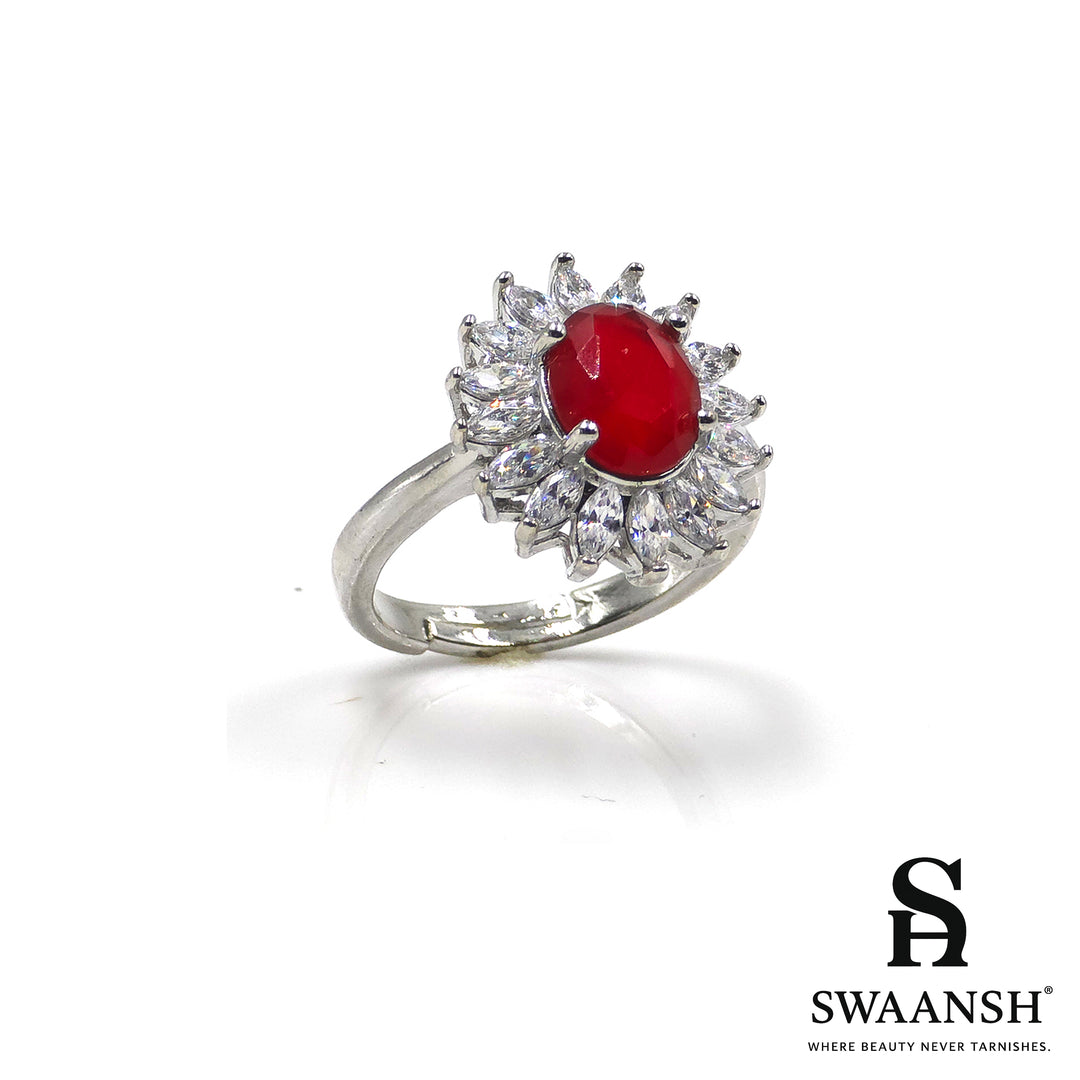 Silver ring with ruby red oval centre and floral zircon crown halo – The Scarlet Crown Ring by Swaansh