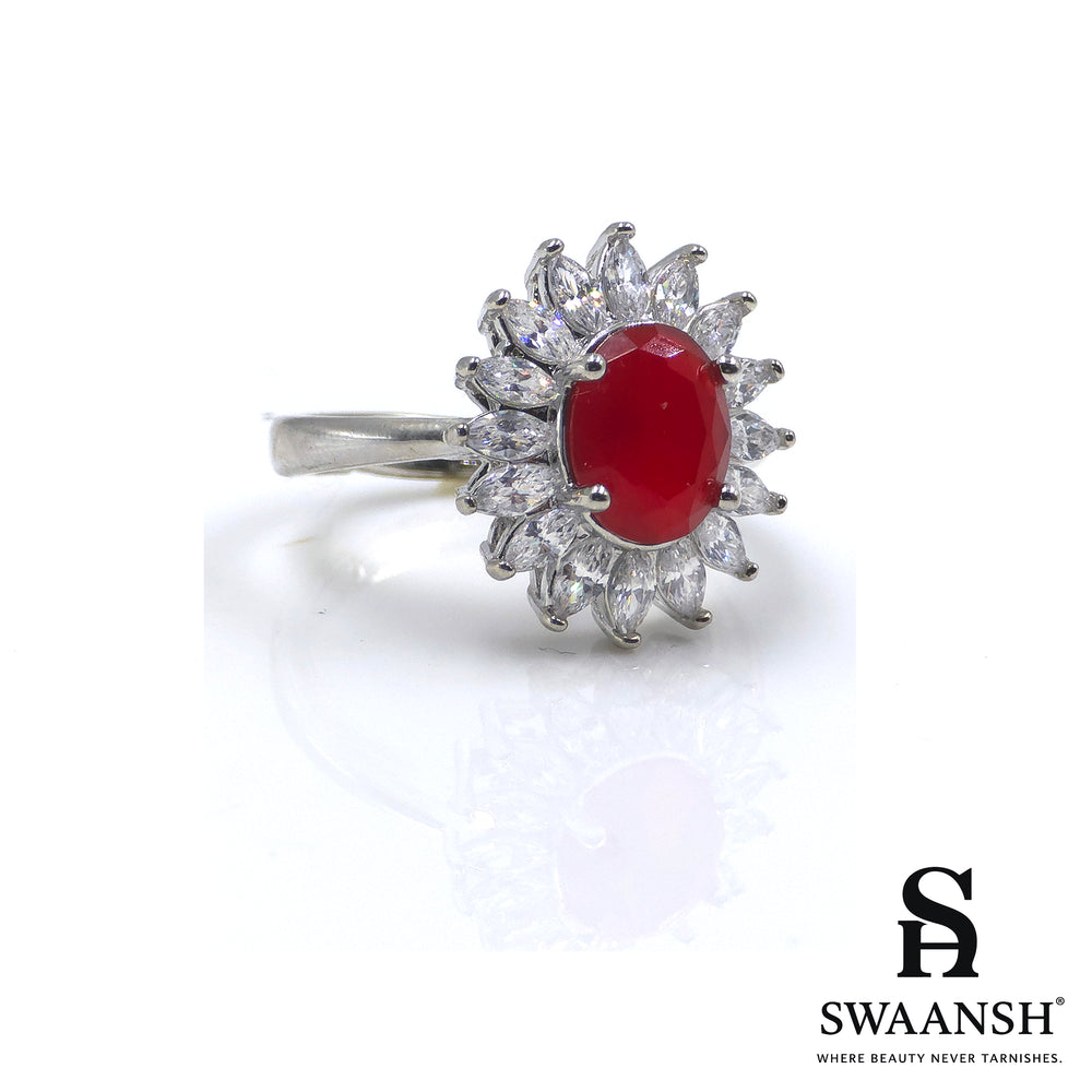 Silver ring with ruby red oval centre and floral zircon crown halo – The Scarlet Crown Ring by Swaansh